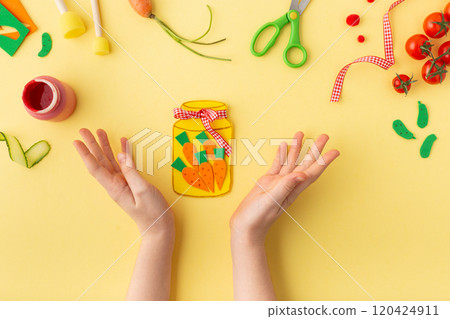 Paper jar with vegetables (tomato, carrot and cucumber) on yellow idea for kindergarten kids craft 120424911