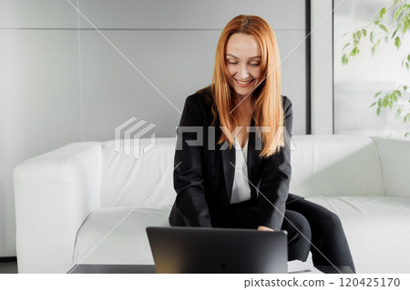 Business Professional Working on Laptop Business Professional Working on Laptop 120425170
