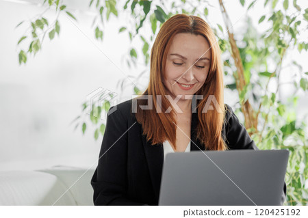 Portrait of Woman Working on Laptop 120425192