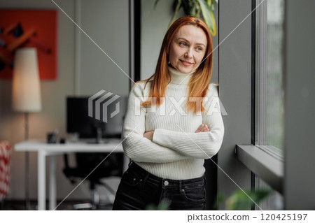 Woman in Modern Office by Window Woman in Modern Office by Window 120425197