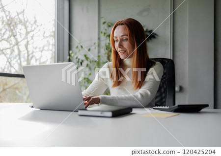 Woman Working on Laptop Woman Working on Laptop 120425204