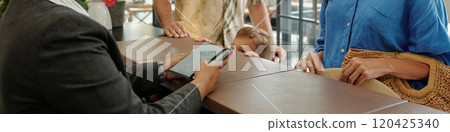 Taking Orders at Rustic Cafe Counter from Customers 120425340