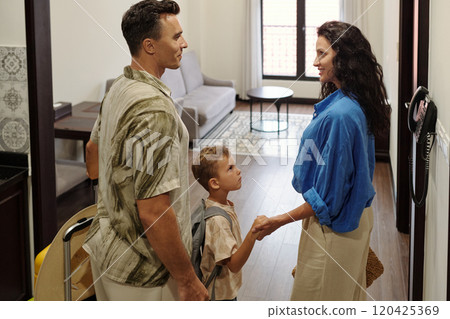 Welcoming Family Arriving in Bright Living Space 120425369