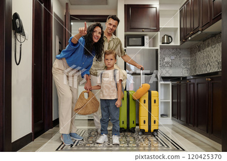 Family Arriving at Home with Luggage and Smiling Faces Family Arriving at Home with Luggage and Smiling Faces 120425370