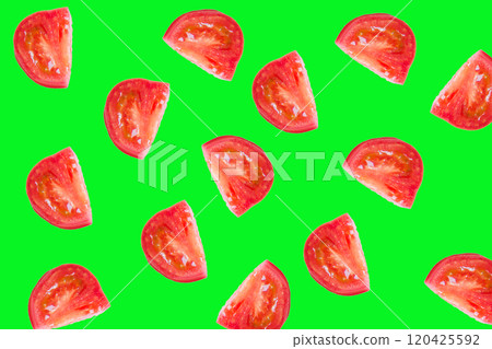 Slice the tomato on a bright green background 120425592