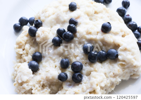 Oatmeal porridge with blueberry closeup 120425597
