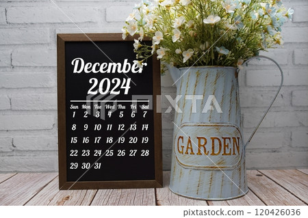 December 2024 monthly calendar on chalkboard for planning and management 120426036