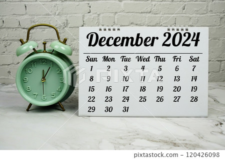 DECEMBER 2024 monthly calendar for planning and management concept with alarm clock on marble background 120426098