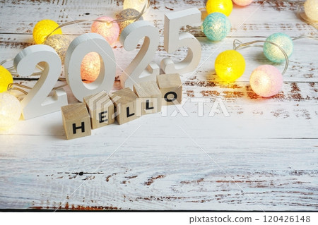 Hello 2025 word alphabet letters on wooden background Hello 2025 word alphabet letters on wooden background 120426148