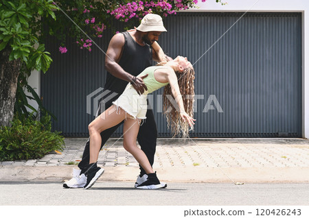 Young Couple Dancing Together Outdoors 120426243