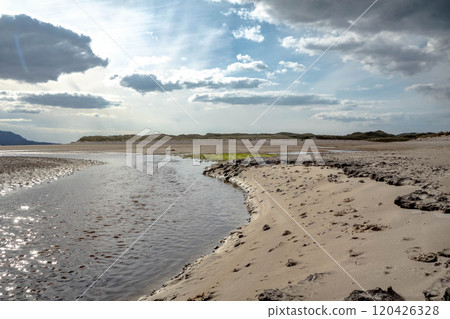 The stream that flows from Sheskinmore Nature Reserve to Ballinravey Strand between Ardara and Portnoo in Donegal - Ireland 120426328