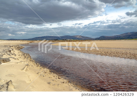 The stream that flows from Sheskinmore Nature Reserve to Ballinravey Strand between Ardara and Portnoo in Donegal - Ireland 120426329