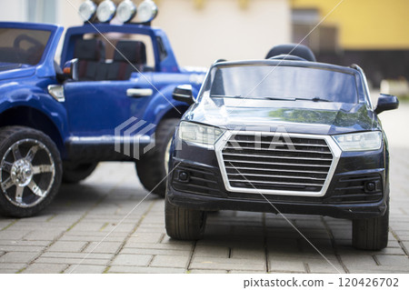 Children's toy black and blue cars on the road. 120426702