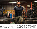 Male athlete in the gym with car tires. 120427045