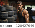 Male athlete in the gym with car tires. 120427049