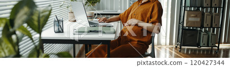 Working in Modern Office with Open Laptop Working in Modern Office with Open Laptop 120427344