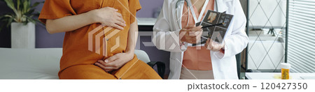 Consulting with Doctor in Medical Office Consulting with Doctor in Medical Office 120427350