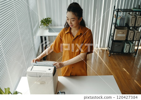 Pregnant Woman Operating Office Printer with Careful Attention 120427384