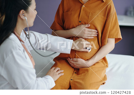 Examining Pregnant Patient with Stethoscope in Hospital Room Examining Pregnant Patient with Stethoscope in Hospital Room 120427428