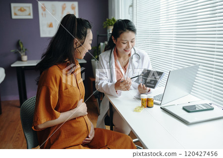 Expecting Mother Conversing with Female Doctor Expecting Mother Conversing with Female Doctor 120427456