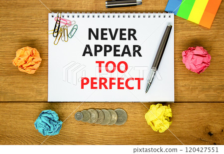 Never appear too perfect symbol. Concept words Never appear too perfect on beautiful white note. Beautiful wooden background. Black pen. Business never appear too perfect concept. Copy space. 120427551