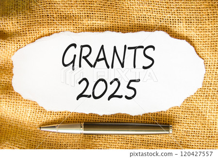 Planning grants 2025 new year symbol. Concept words Grants 2025 on beautiful white paper. Beautiful canvas background. Beautiful metallic pen. Business grants 2025 new year concept. Copy space. 120427557