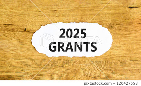 Planning 2025 grants new year symbol. Concept words 2025 Grants on beautiful white paper. Beautiful wooden background. Business 2025 grants new year concept. Copy space. 120427558