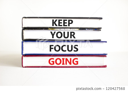 Keep your focus going symbol. Concept words Keep your focus going on beautiful books. Beautiful white table white background. Business and keep your focus going concept. Copy space. Keep your focus going symbol. Concept words Keep your focus going on beautiful books. Beautiful white table white background. Business and keep your focus going concept. Copy space. 120427568
