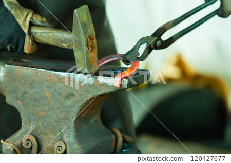 Hammering glowing steel - to strike while the iron is hot. 120427677