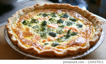 Broccoli and salmon quiche on wooden table, savory pastry and gourmet cuisine concept 120427911