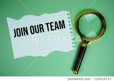 Join our team text on paper torn with magnifying glass top view on green background 120428155