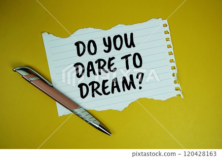 Do You Dare To Dream? text written on paper torn top view on yellow background Do You Dare To Dream? text written on paper torn top view on yellow background 120428163