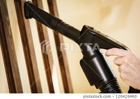 Woman cleaning dust on hanger Woman cleaning dust on hanger 120428460