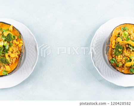 Stuffed kabocha squash with quinoa, broccoli and chickpea pumpkin hummus 120428582