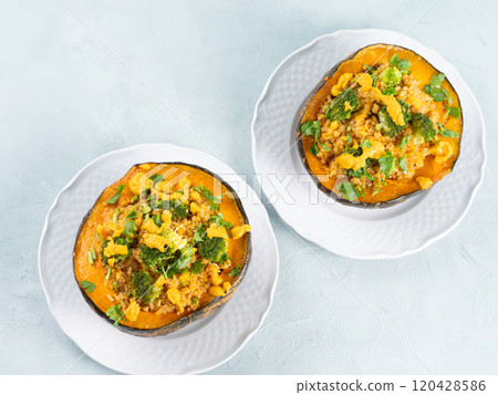 Stuffed kabocha squash with quinoa, broccoli and chickpea pumpkin hummus 120428586