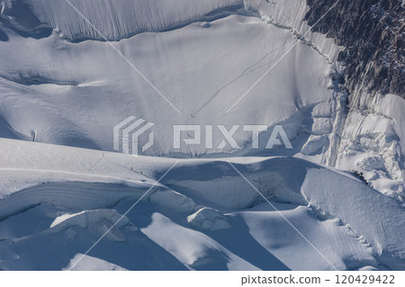 Climbers on the Mont Blanc massif, France Climbers on the Mont Blanc massif, France 120429422
