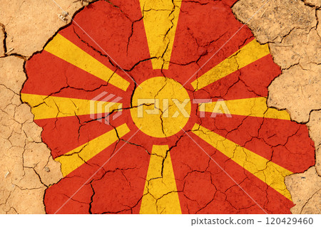 Drought. On dry, cracked ground, the image of the flag of Macedonia. 120429460