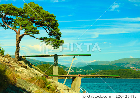 View of diving board. Springboard to dive at water. 120429483