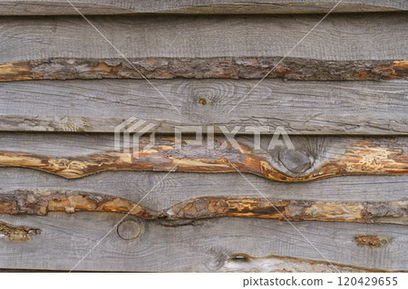 A wall of unhewn boards, built in fly-fishing. 120429655