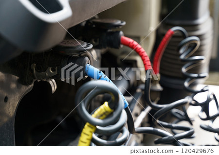Connecting pneumatic and electrical hoses and cables to a truck semi-trailer 120429676