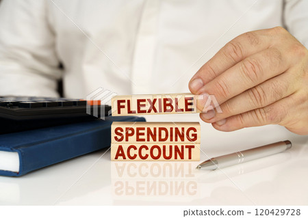 In the hands of a businessman, wooden blocks with the inscription - FLEXIBLE SPENDING ACCOUNT In the hands of a businessman, wooden blocks with the inscription - FLEXIBLE SPENDING ACCOUNT 120429728