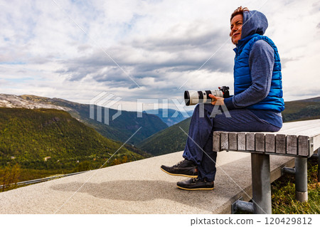 Woman on Vedahaugane rest stop, Norway Woman on Vedahaugane rest stop, Norway 120429812