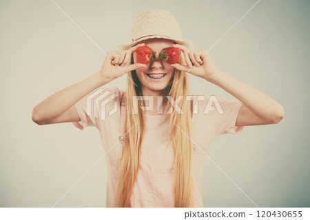 Happy woman holding strawberries Happy woman holding strawberries 120430655