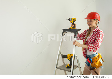 Woman with repairing tools and ladder 120430692