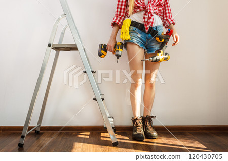 Woman with repairing tools and ladder 120430705