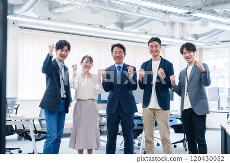 Smiling business person posing in the office 120430982