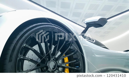 Close up side view with red braking lights of exposed silver luxury sports car 120431410