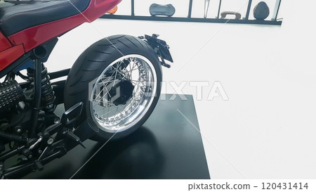 Side view of rear wheel of exposed luxury motorcycle 120431414