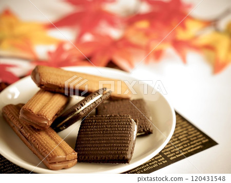 Cookies surrounded by autumn leaves 120431548