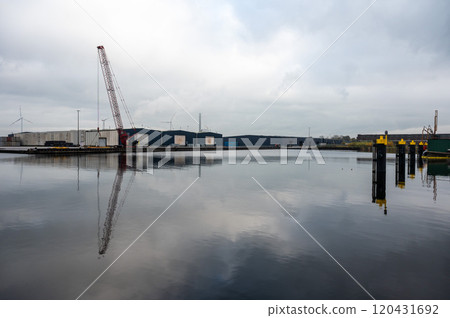 Loading cranes of the VCK Logistics company in the Bering and Suez port of Amsterdam, Netherlands 120431692